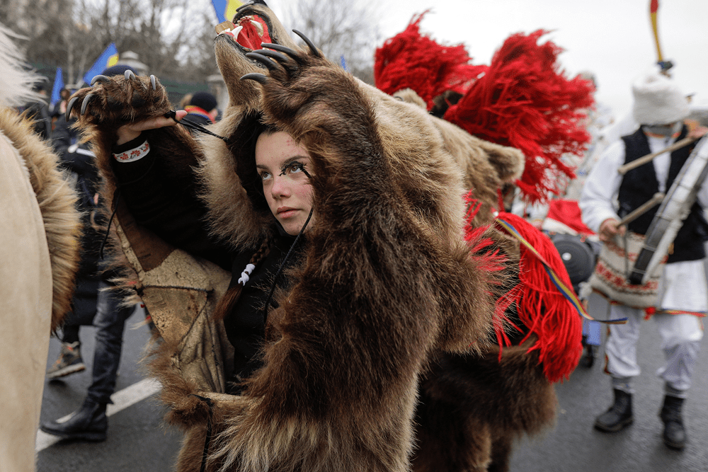 Girl dressed as a bear for the Bear Dance